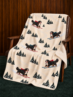 Bernese Mountain Dog beige Christmas skiing fleece blanket — chair view