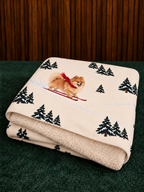 Pomeranian beige Christmas skiing fleece blanket — folded view