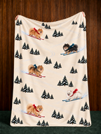 Pomeranian beige Christmas skiing fleece blanket — held view